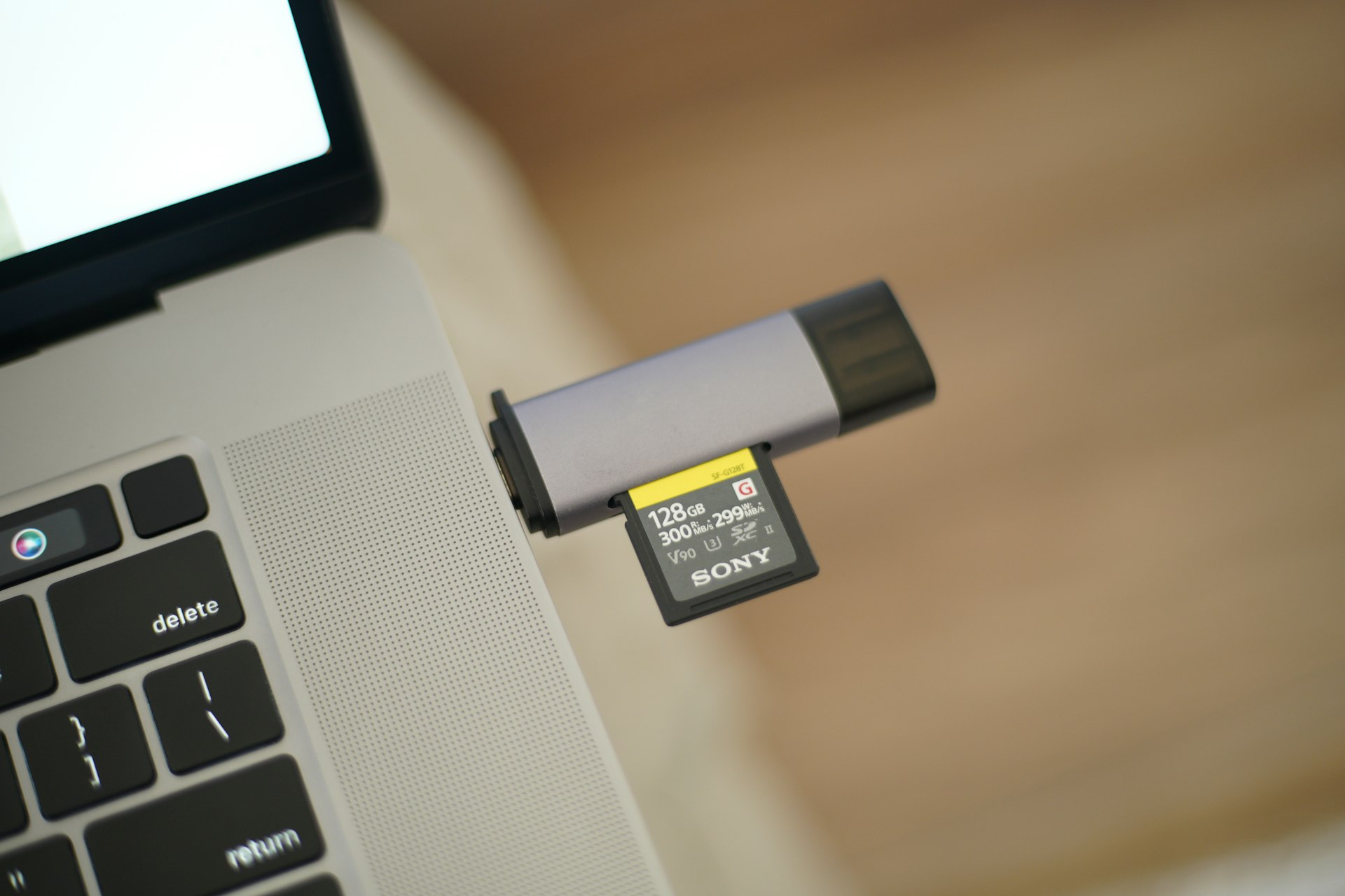 A laptop with a battery attached to it